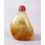 A CHINESE CARVED JADE PEBBLE SNUFF BOTTLE, with trace gilt decoration of landscapes, 8cm