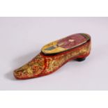 AN UNUSUAL PERSIAN LACQUER PAPIER MACHE SHOE SHAPED SNUFF, The top with the view of a figure, 9cm.