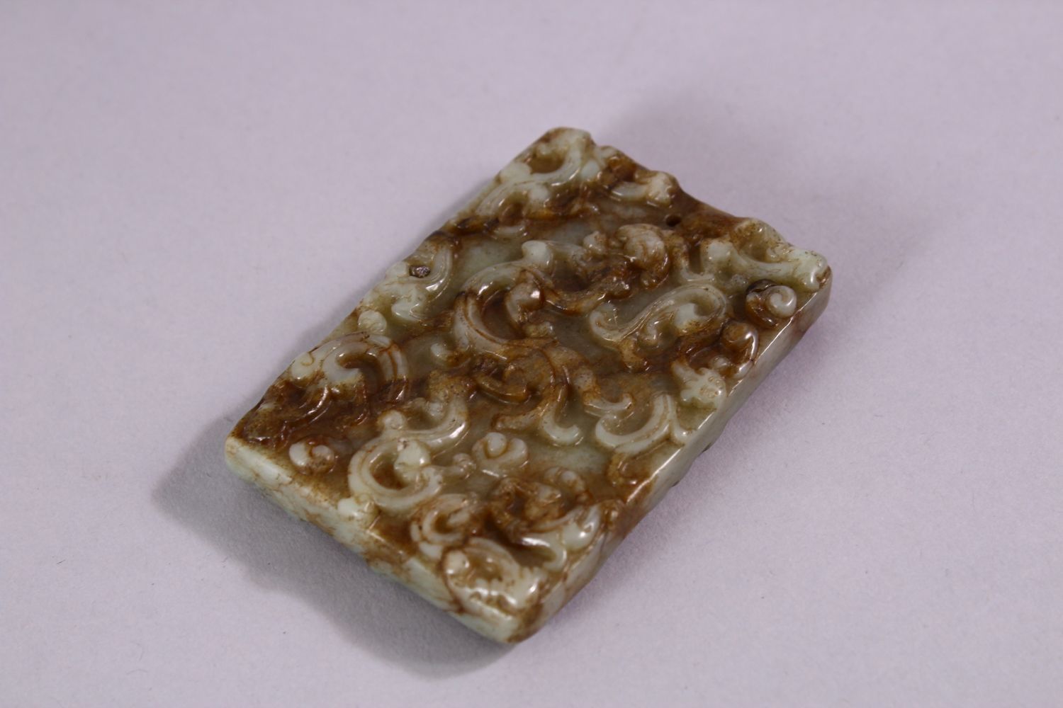 A 19TH CENTURY SPECKLED JADE RECTANGLAR TABLET, carved with scrolls, 6.5cm x 4.5cm. - Image 3 of 3