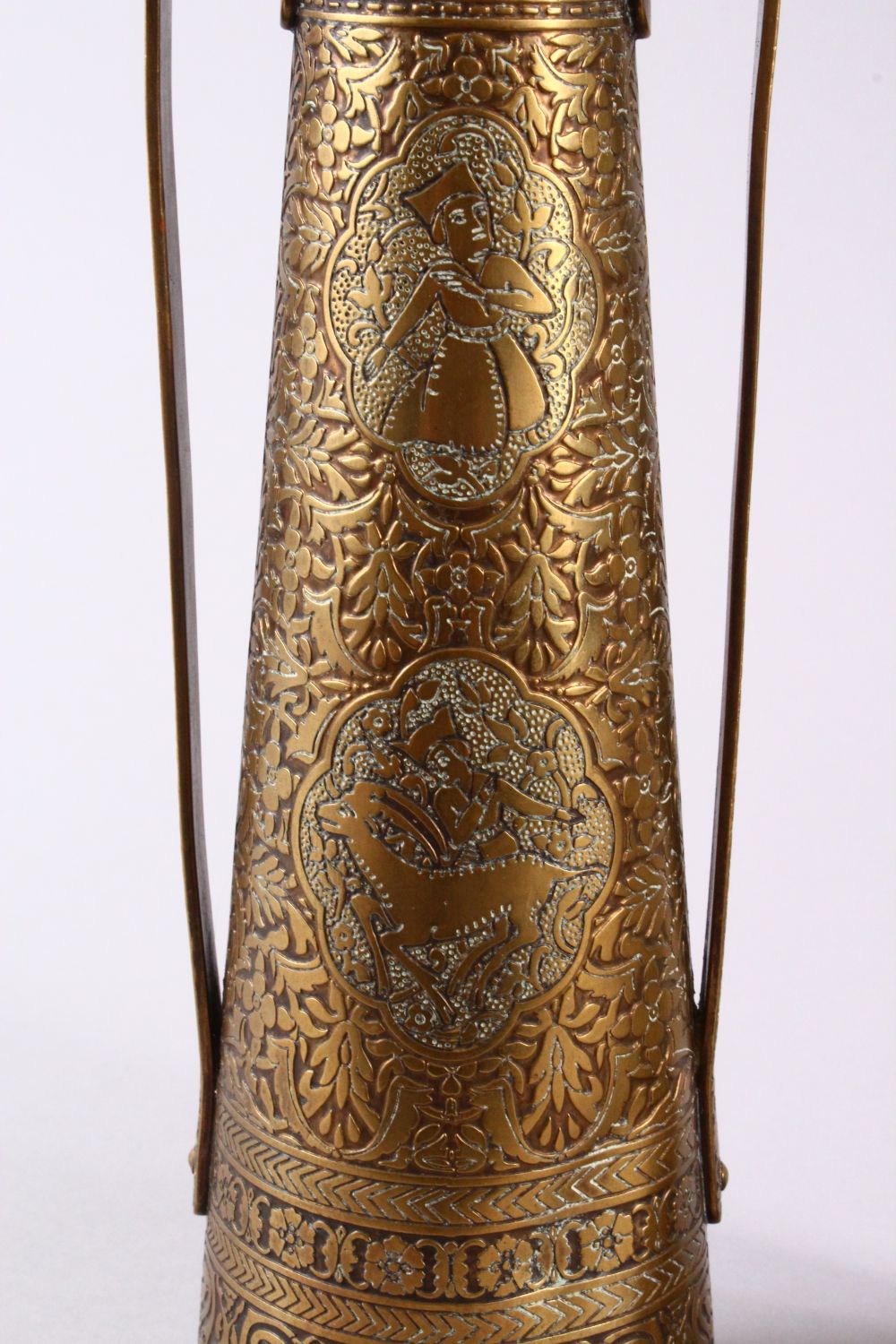 A PAIR OF PERSIAN BRASS ENGRAVED VASES, with twin handles, carved panels of figures and foliage, - Image 2 of 11