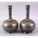 A PAIR OF 18TH/19TH CENTURY INDIAN BIDRI SILVER INLAID BOTTLES, 26cm high.