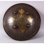 A LARGE 19TH CENTURY PERSIAN GILT DECORATED STEEL SHIELD, with carved decoration of figures, bands