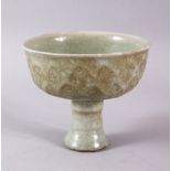 A CHINESE CELADON CRACKLE GLAZED PORCELAIN STEM DISH, the body with lappet style moulded