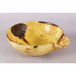 A GOOD IRAN STYLE POTTERY POURING BOWL, decorated with a yellow ground with brown splash decoration,