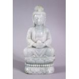 A CHINESE CARVED JADEITE FIGURE OF BUDDHA / DEITY, in a seated pose upon lotus, holding a vessel,