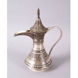 AN ISLAMIC OTTOMAN SILVER SILVER DALLAH COFFEE POT, decorated with motif decoration and a hinged