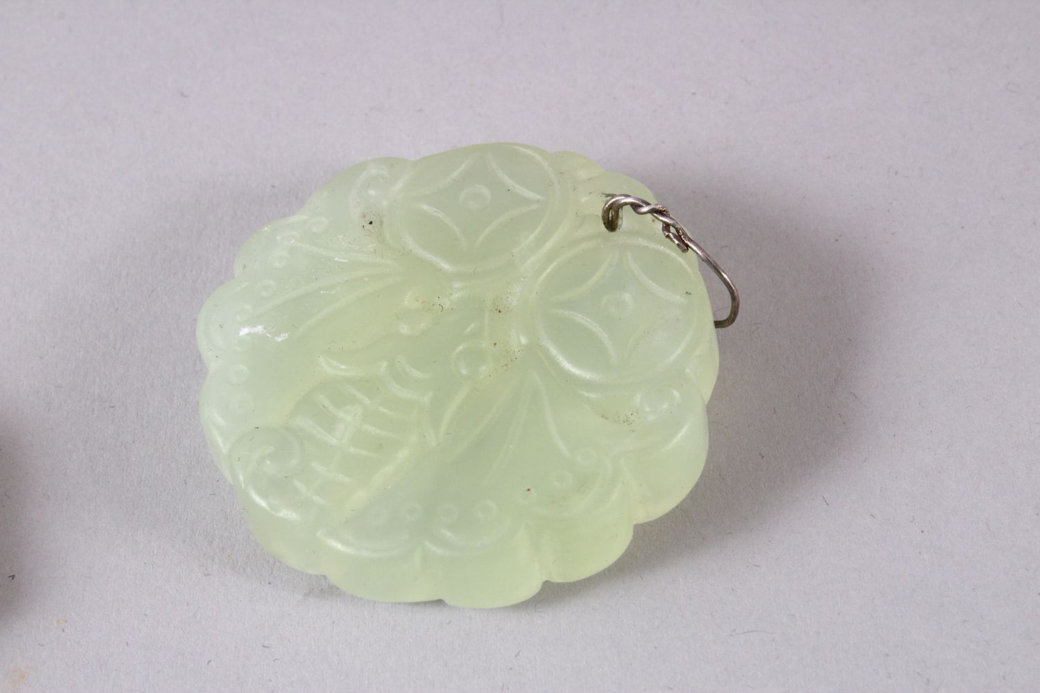 TWO CHINESE CARVED JADE BUTTERFLY & DRAGON BI DISK PENDANTS, one pale almost translucent jade carved - Image 2 of 4