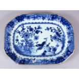 AN 18TH CENTURY CHINESE BLUE & WHITE PORCELAIN SERVING DISH, decorated with peacocks in landscape