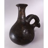 A GOOD EARLY AMLASH RYTON 1000BC POTTERY RAMS HEAD VASE, with a moulded base with a rams head