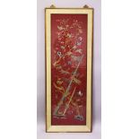 A LARGE CHINESE EMBROIDERED PANEL, depicting butterflies and birds amongst bamboo and native