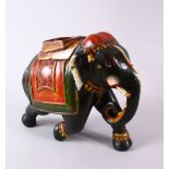 AN INDIAN LACQUER MODEL ELEPHANT, with decorated wears, 30cm wide