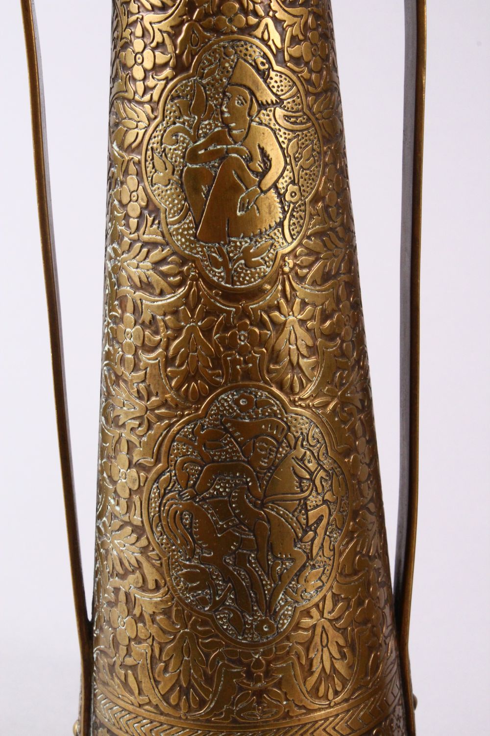 A PAIR OF PERSIAN BRASS ENGRAVED VASES, with twin handles, carved panels of figures and foliage, - Image 6 of 11