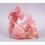 A GOOD CHINESE CARVED ROSE QUARTZ FISHERMAN GROUP, the fisherman stood holding his catch with his