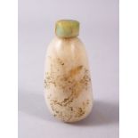 A CHINESE CARVED JADE SNUFF BOTTLE, with trace gilt decoration of birds and flora, 7.5cm high