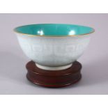 A CHINESE CARVED DRAGON CELADON & TURQUOISE RICE BOWL - The interior with a turquoise glaze, the