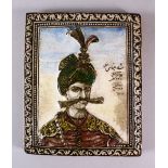A 19TH CENTURY PERSIAN QAJAR MOULDED POTTERY TILE depicting Shah Abbas, dated 1317/1899 ad, 25cm x