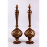 A PAIR OF ISLAMIC DAMASCENE INLAID STEEL BOTTLE & COVERS, each with gold inlaid panels of star