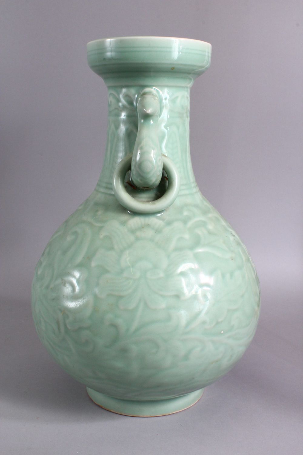 A LARGE CHINESE CELADON PORCELAIN TWIN HANDLE VASE, the body with carved floral decoration beneath a - Image 6 of 9