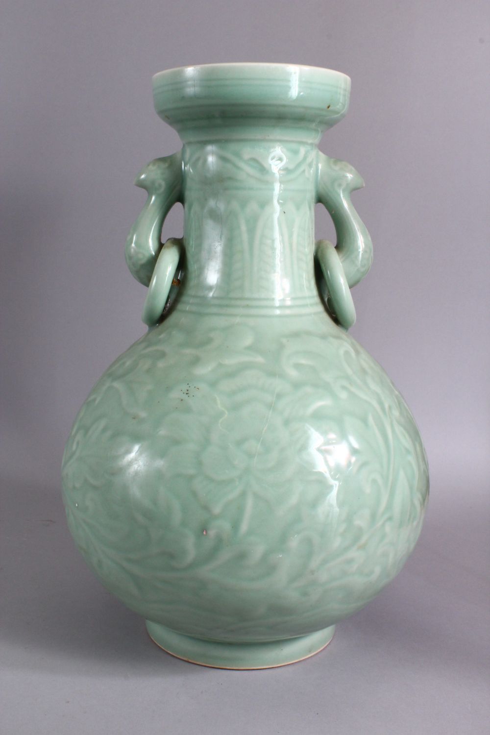 A LARGE CHINESE CELADON PORCELAIN TWIN HANDLE VASE, the body with carved floral decoration beneath a - Image 5 of 9