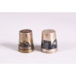 TWO 19TH CENTURY IRAQ SILVER & NIELLO INLAID THIMBLES, each with inlaid landscape views,