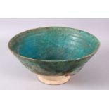 A 13TH CENTURY IRANIAN KASHAN POTTERY TURQUOISE BOWL, 18CM.