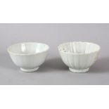 A SMALL PAIR OF CHINESE MONOCHROME WHITE PORCELAIN PETAL MOULDED BOWLS, each with a ribbed body in