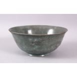 A CHINESE CELADON PORCELAIN DRAGON BOWL, the body with moulded dragons, 15cm.