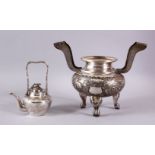 A CHINESE SILVER TWO HANDLED KORO and a small teapot and cover.