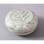 A CHINESE SONG STYLE FLORAL CYLIDRICAL BOX & COVER, with moulded floral decoration, 8cm diameter.