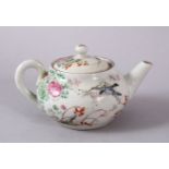 A SMALL CHINESE FAMILLE ROSE TEAPOT & COVER, decorated with native scenes of flora and birds, the