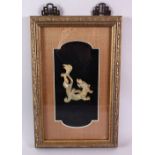 A GOOD CHINESE FRAMED CARVED JADE FIGURE OF A CHILONG, the archaic formed chilong within a box