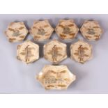 A SET OF EIGHT JAPANESE SATSUMA EARTHENWARE DISHES, 7 smaller plates and one larger dish, each