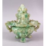 A CHINESE CARVED GREEN QUARTZ TWIN HANDLE VASE AND COVER, with lion dog carved finial's, upon tripod