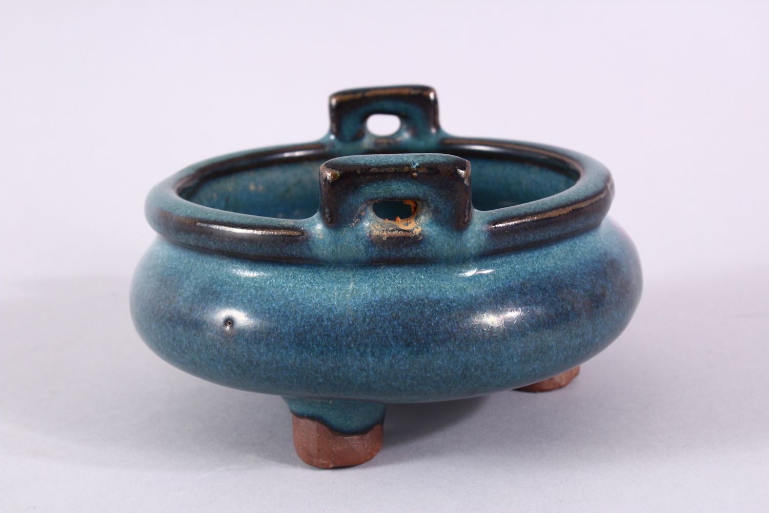 A CHINESE JUN WARE TWIN HANDLE CENSER, with a graduated blue to red glaze, twin handles and tripod - Image 2 of 6