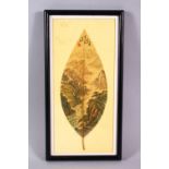 A CHINESE PAINTED & FRAMED BANYAN LEAF, the leaf painted with scenes of a mountainous landscape, the