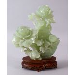 A CHINESE CARVED GREEN JADE FLORAL VASE, COVER & STAND, the vase enclosed with carved floral