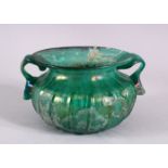 A RARE EARLY ISLAMIC OR ROMAN BLUE GLASS TWIN HANDLED BOWL, with twin moulded handles and a flared