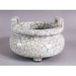 A CHINESE CRACKLE GLAZED PORCELAIN CENSER, the body with wire style decoration twin handles, 14cm