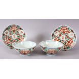 A PAIR OF 19TH CENTURY CHINESE WOTSI PORCELAIN BOWL & SAUCERS, with typical red & green decoration