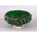 A GOOD KASHAN MOULDED GREEN GLAZED POTTERY BOWL, 14cm.