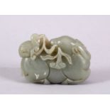 A GOOD CHINESE CARVED JADE FIGURE OF A DEER & DUCK, the duck upon the recumbent deer back, with