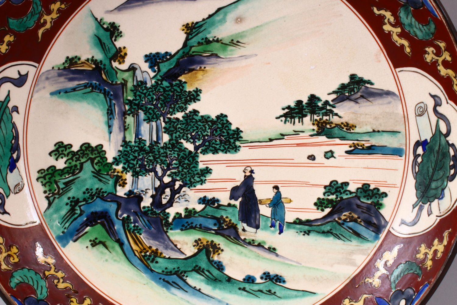 A JAPANESE MEIJI PERIOD KUTANI CHARGER, decorated with scenes of figures in native landscapes, the - Image 2 of 4