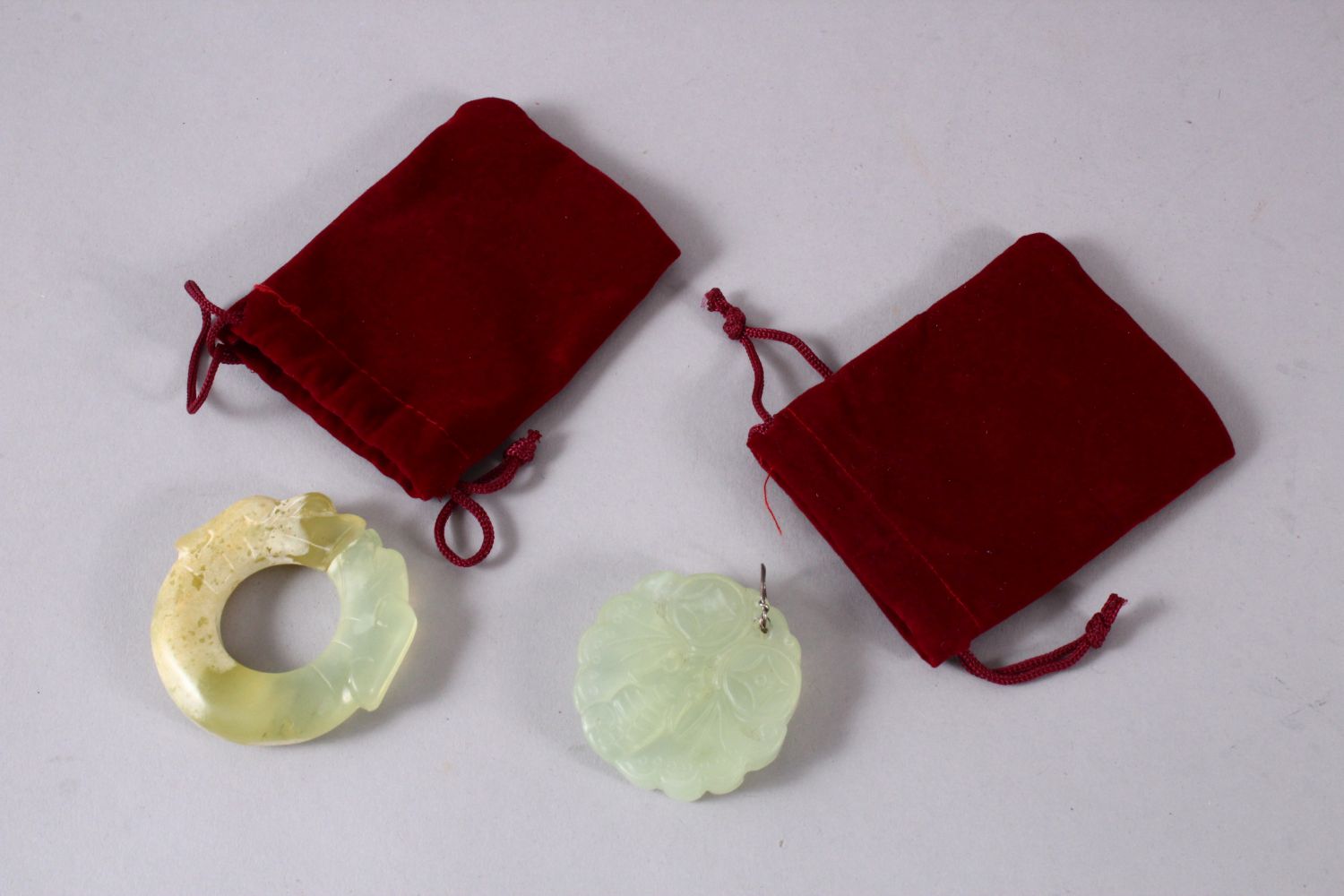 TWO CHINESE CARVED JADE BUTTERFLY & DRAGON BI DISK PENDANTS, one pale almost translucent jade carved - Image 4 of 4