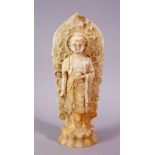 A 19TH / 20TH CENTURY CHINESE CARVED WHITE JADE / SOAPSTONE FIGURE OF A DEITY / BUDDHA, stood upon a