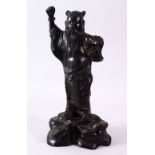 A GOOD 19TH CENTURY BRONZE JAPANESE FIGURE OF AN IMMORTAL, with long flowing beard, arm raised on