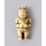 A GOOD EARLY CHINESE CARVED IVORY FIGURE OF A SEMI NUDE MAN - the figure stood in traditional