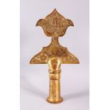 AN 18TH CENTURY TURKISH OTTOMAN GILDED COPPER TOMBAK ALEM, with carved calligraphic decoration, 30cm