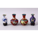 FOUR SMALL CHINESE CLOISONNE VASES - one pair with red ground and flora, 6.5cm, together ith two