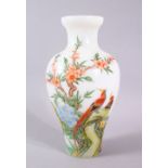 A 19TH CENTURY CHINESE OPAQUE GLASS VASE, painted with birds in a tree, signed, 21cm high.