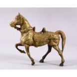A HEAVY CHINESE BRONZE FIGURE OF A HORSE, in a striding pose, 21cm